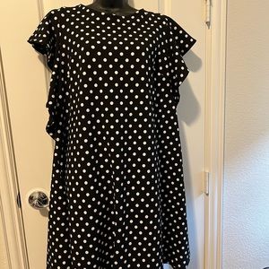 Black and white polka dotted dress with pockets. Cute, fun, and comfy dress.